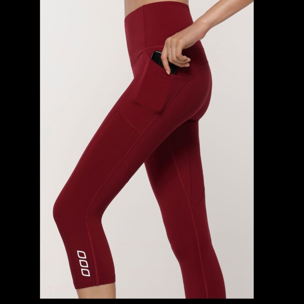 red lorna jane 7/8 tights with side pockets